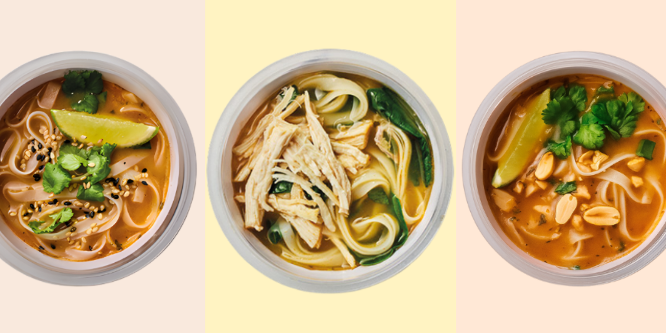 Three different bowls of colorful noodle soup, each garnished with fresh ingredients.
