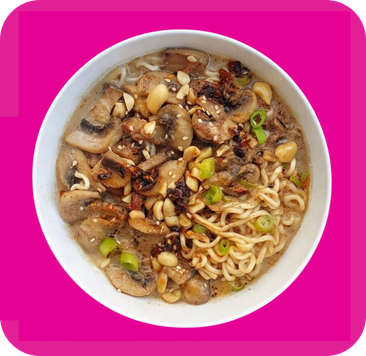 A vibrant bowl of ramen noodles topped with sautéed mushrooms, peanuts, and green onions.