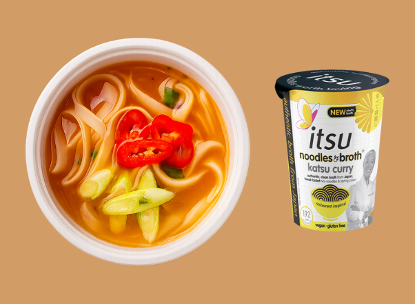 Itsu katsu curry noodles with red chilies and green onions beside its product cup.