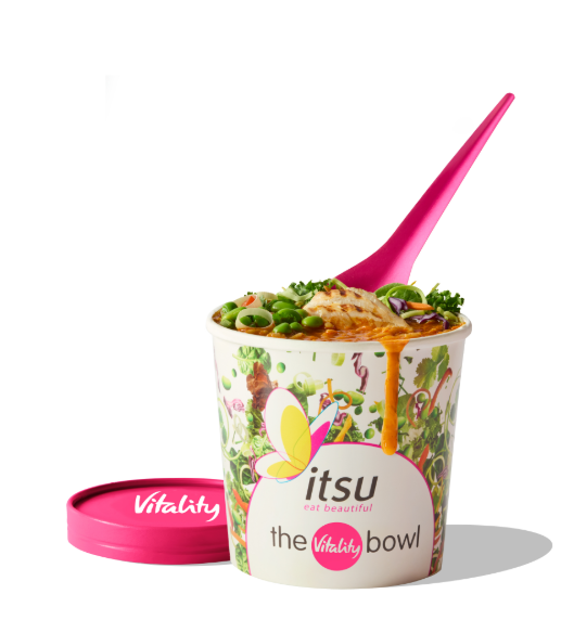 A colorful itsu noodle bowl with a pink spoon, next to a pink "Vitality" lid.