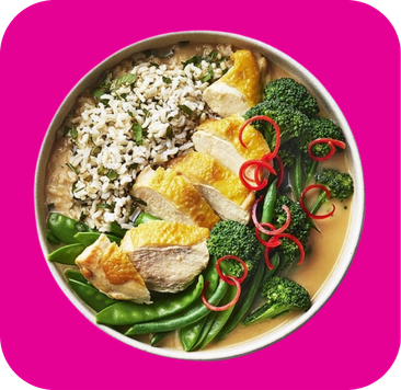 Roasted chicken breast slices, herb rice, broccoli, peas, and red chili in a creamy curry.