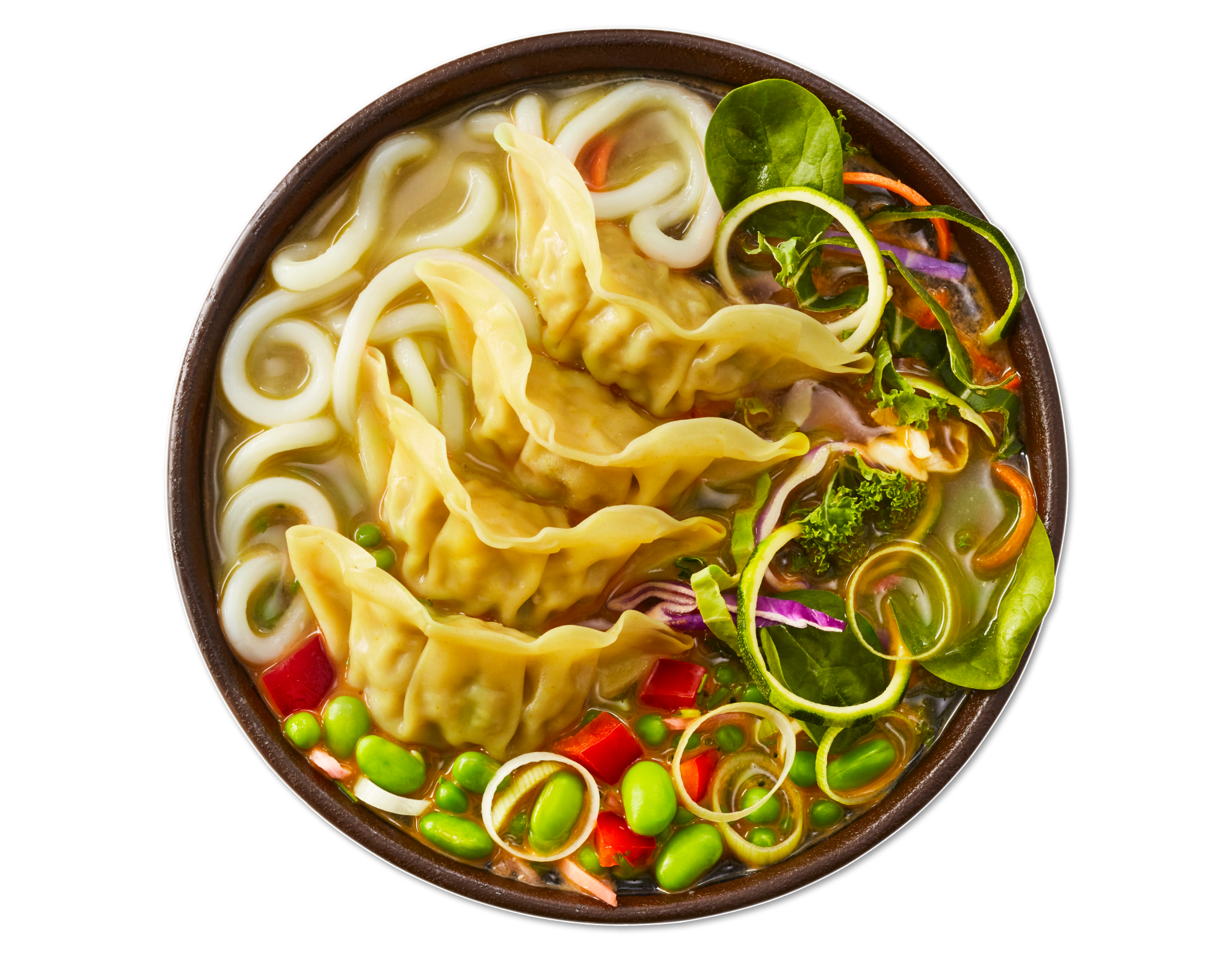Bowl of udon noodle soup with dumplings, edamame, spinach, and colorful vegetables.