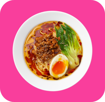 Spicy ramen in a white bowl with ground pork, bok choy, and a soft-boiled egg.