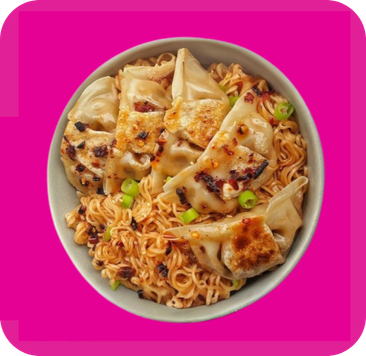 Overhead view of pan-fried dumplings and chili ramen noodles garnished with green onions.