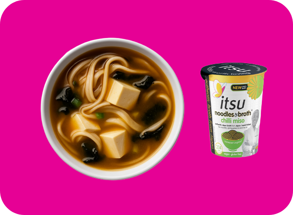 Miso soup bowl with noodles, tofu, seaweed, and an itsu chili miso cup.