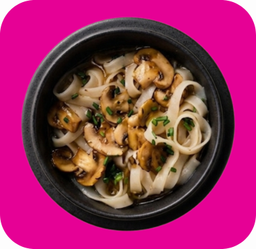 White rice noodles with saut&eacute;ed mushrooms and green chives in a dark bowl.