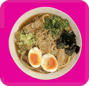 Delicious ramen with pork, soft-boiled eggs, noodles, green onions, and seaweed in a savory broth.