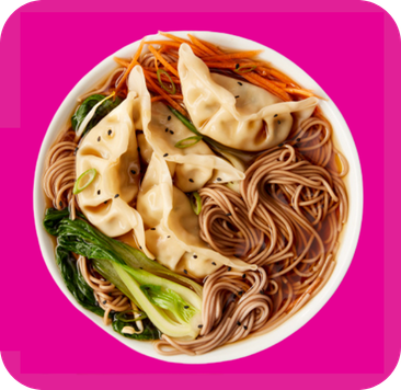 Hearty dumpling noodle soup, featuring bok choy, carrots, and sesame seeds.