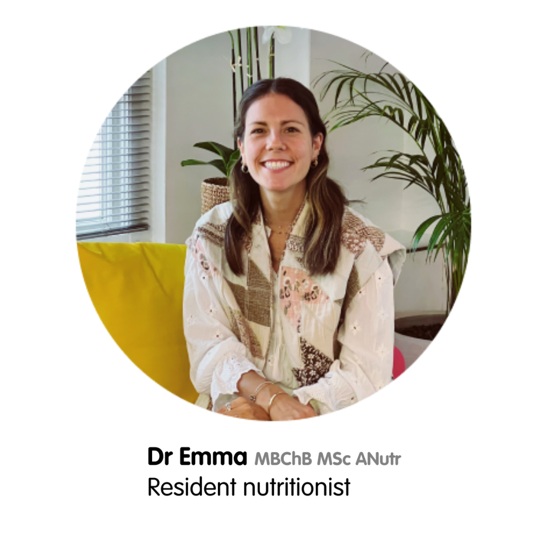 Smiling Dr Emma, a resident nutritionist, in a circular headshot with a plant in the background.