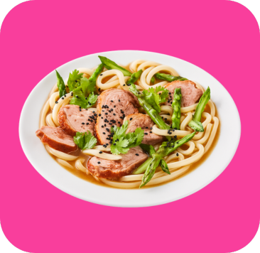 Udon noodles with sliced duck, asparagus, cilantro, and black sesame seeds in savory broth.