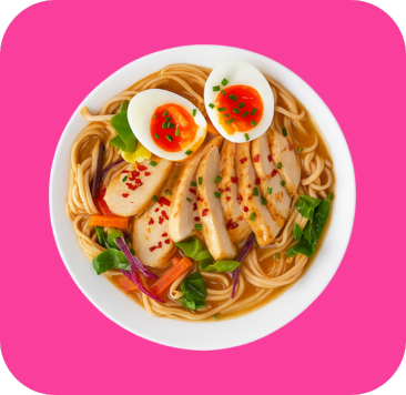 A bowl of ramen with sliced chicken, soft-boiled eggs, noodles, and mixed vegetables.