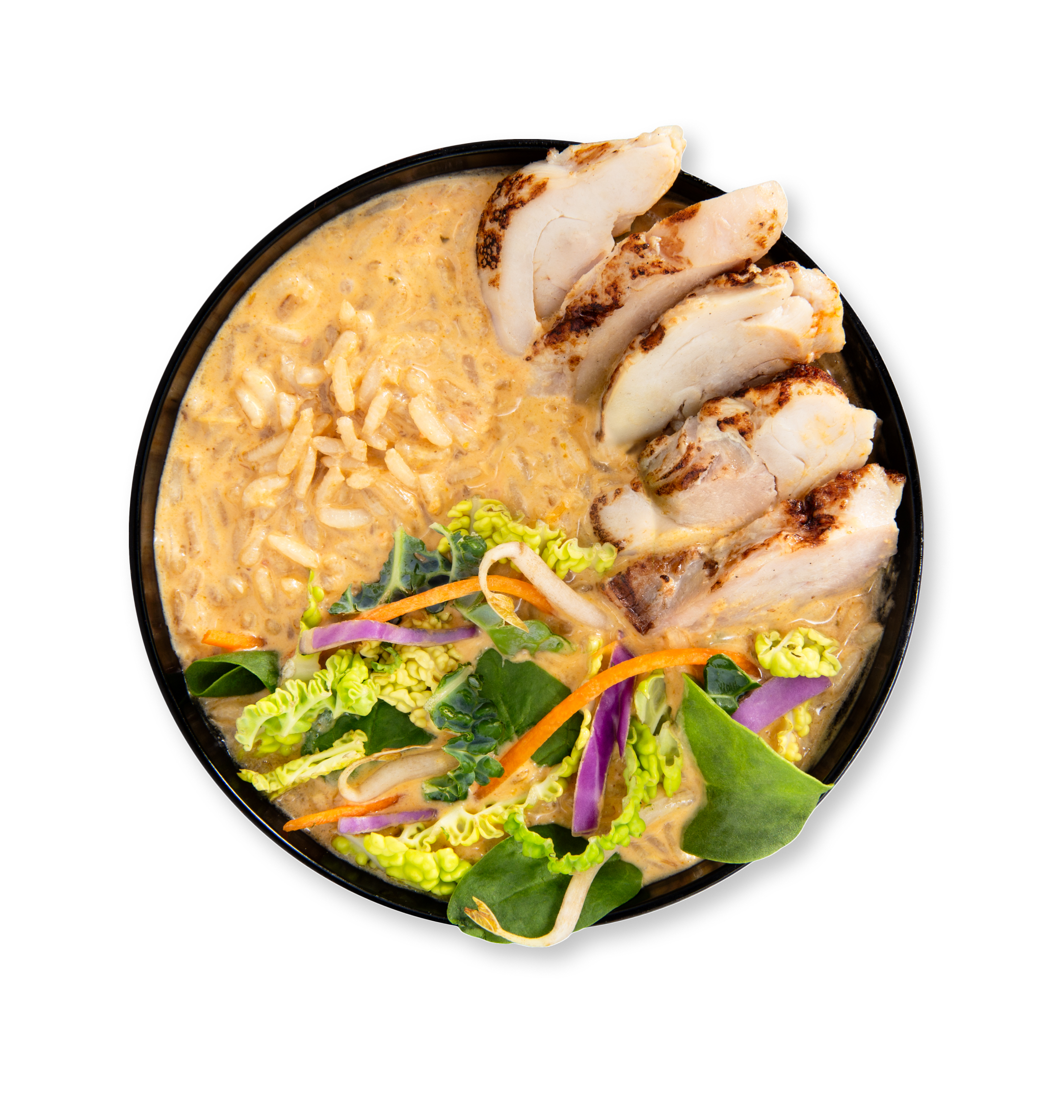Overhead view of a black bowl with creamy noodles, grilled chicken slices, and fresh green salad.