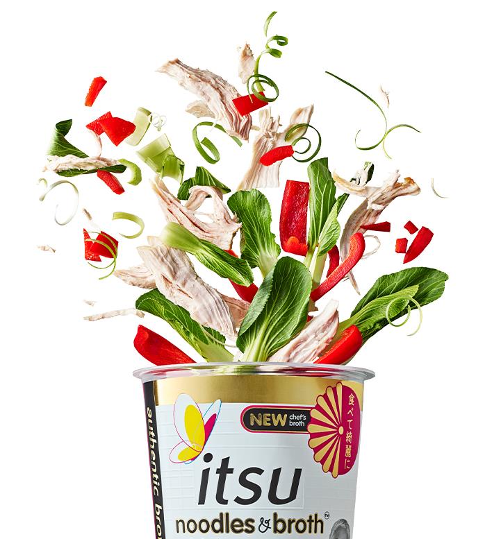 Itsu noodles cup exploding with chicken, bok choy, and red peppers.