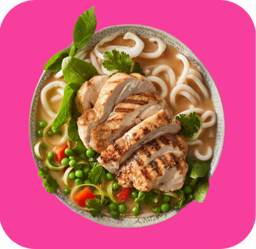 Grilled chicken slices, udon noodles, peas, and green garnish in a creamy broth.