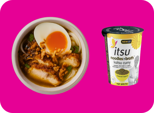 Bowl of chicken katsu curry noodles with an egg, alongside Itsu instant katsu curry.