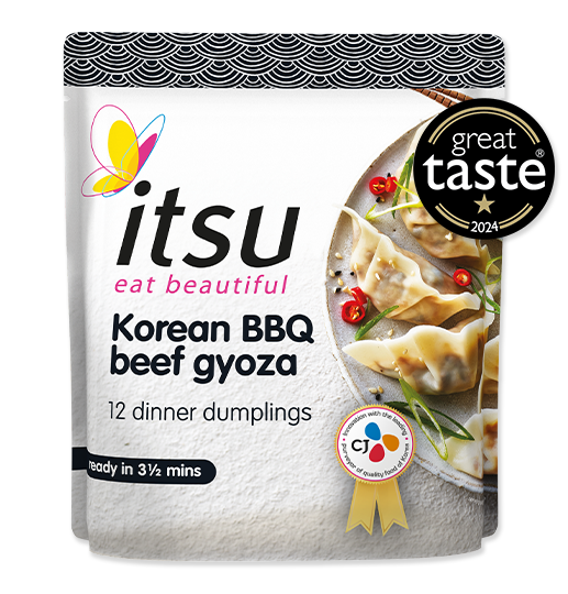itsu Korean BBQ beef gyoza package with award stickers and prepared dumplings.