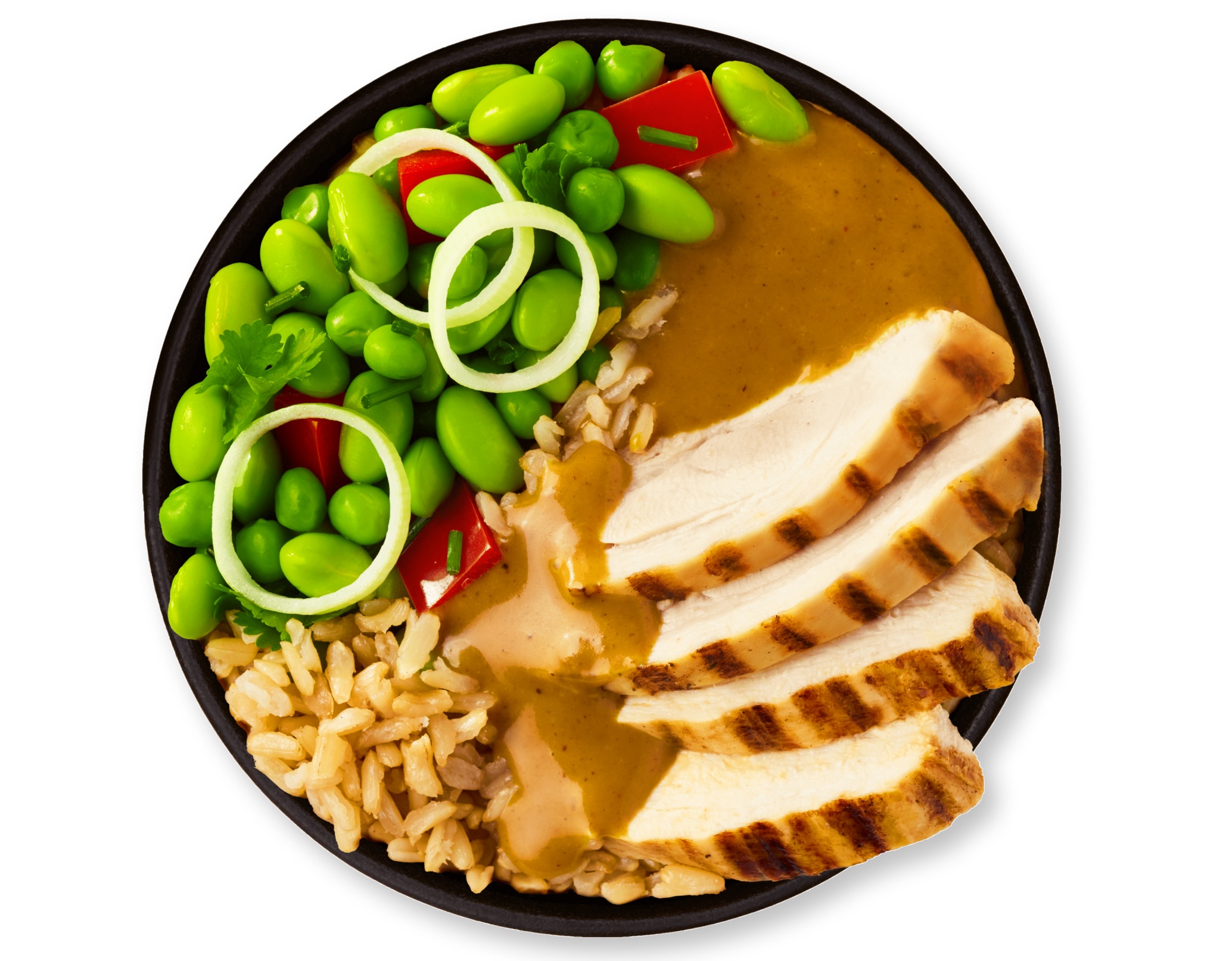 A black bowl with sliced chicken, edamame, rice, and peanut sauce.