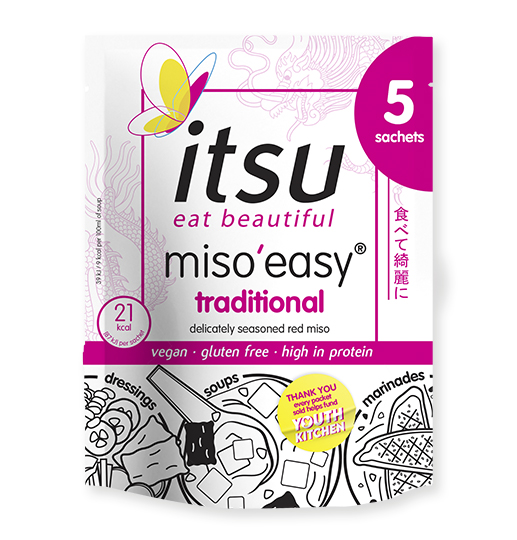 A white and pink Itsu Miso'Easy traditional instant miso soup packet with a yellow butterfly logo.