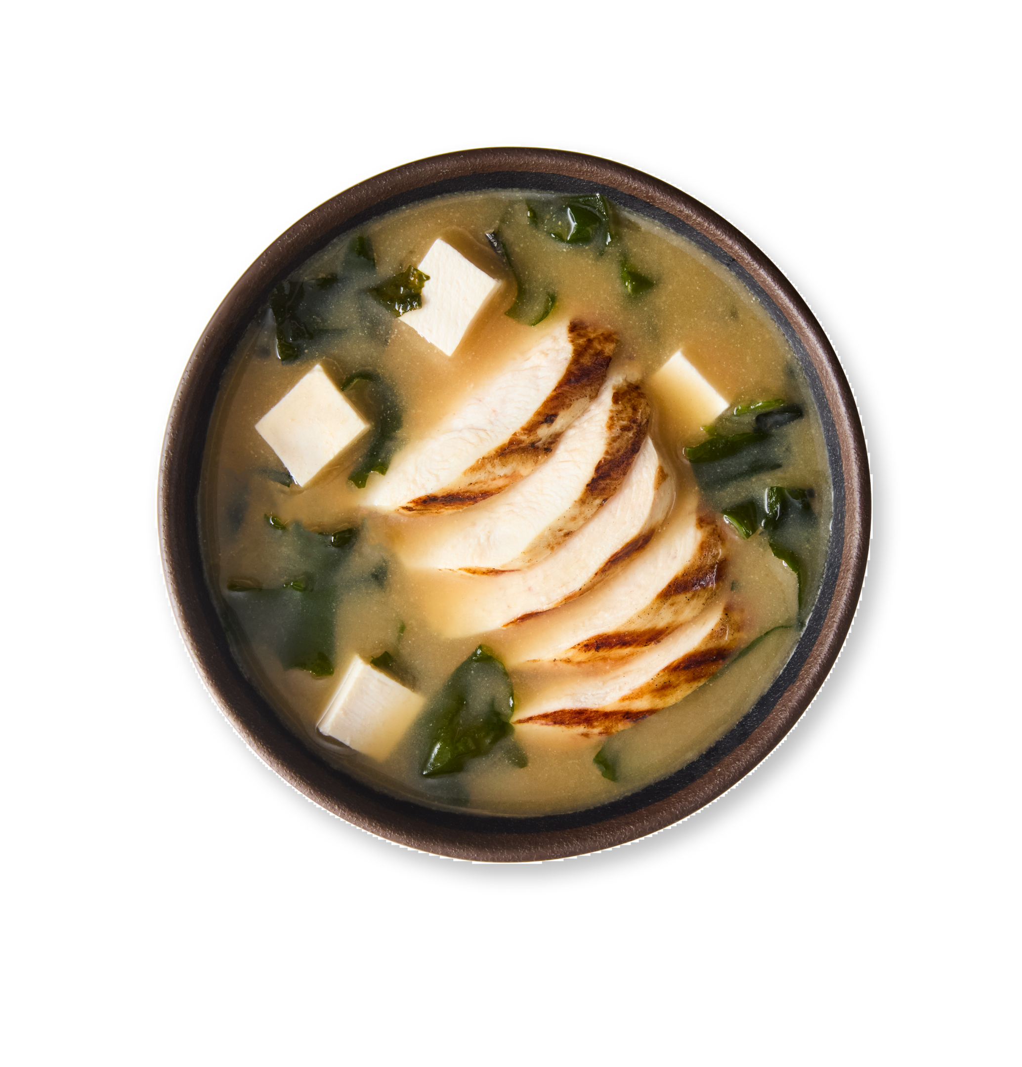 A bowl of miso soup with tofu, seaweed, and sliced grilled chicken.