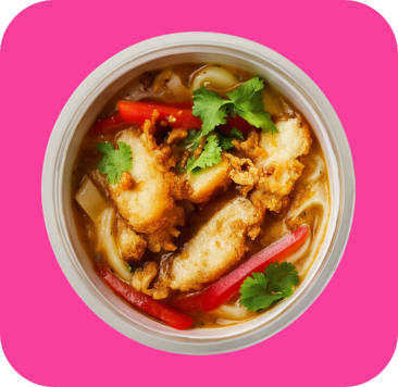 A bowl of hot noodle soup with fried chicken, red peppers, and fresh cilantro.