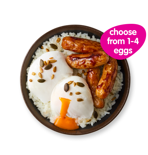 Bowl of white rice with two poached eggs, grilled sausages, and various seeds.