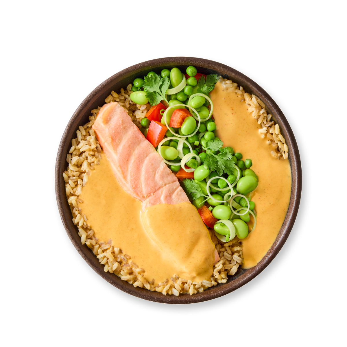 A vibrant bowl of salmon poke with brown rice, edamame, peas, and creamy sauce.