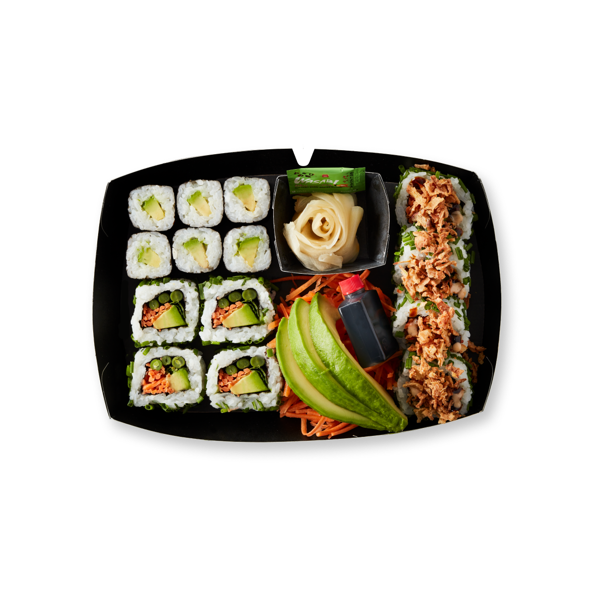 An overhead shot of a black platter filled with various sushi rolls and condiments.
